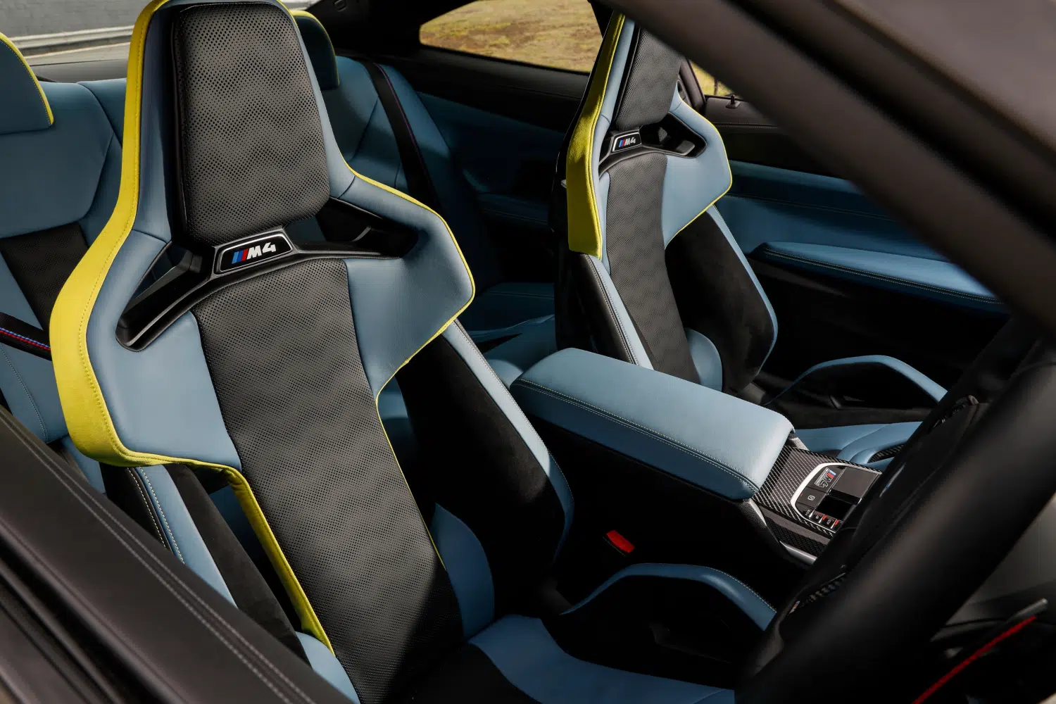 Close-up of carbon fiber weave detail on a BMW M performance seat shell